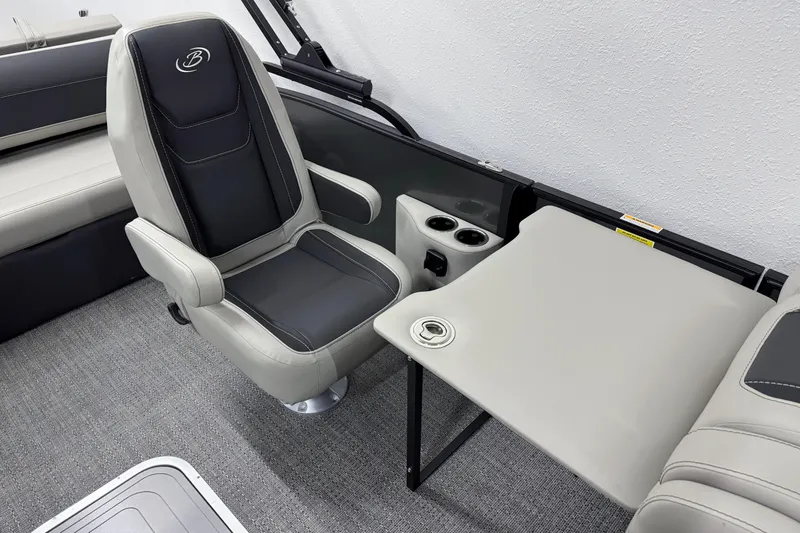 Slide: The Image of 2026 Barletta Cabrio 24UC boat interior with seating and table setup. - 19