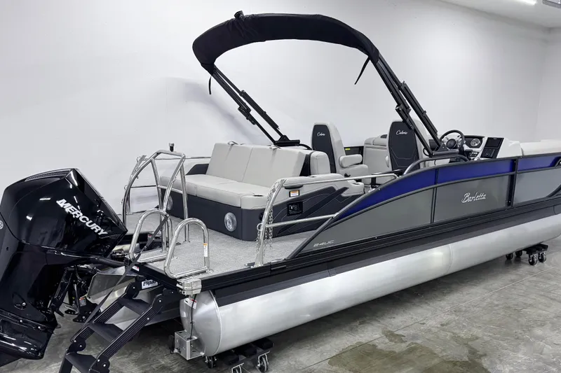 Slide: The Image of 2026 Barletta Cabrio 24UC pontoon boat with Mercury engine, sleek design, and spacious seating. - 3