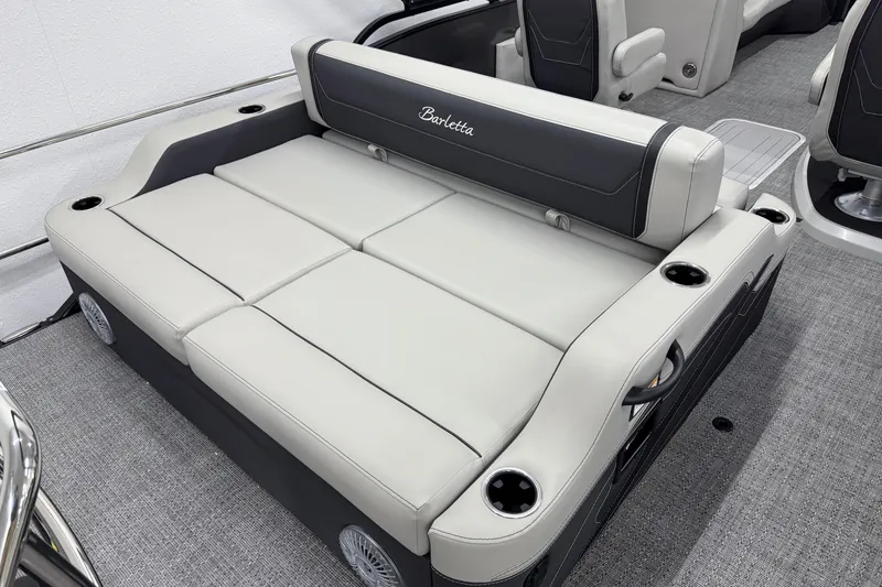 Slide: The Image of 2026 Barletta Cabrio 24UC boat interior with luxurious seating and cup holders. - 5