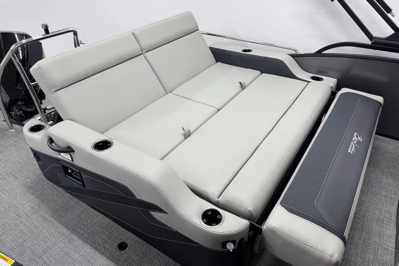 Slide: The Image of 2026 Barletta Cabrio 24UC boat interior with luxurious seating and cup holders. - 8