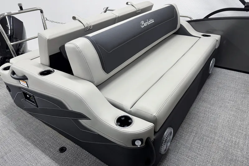 Slide: The Image of 2026 Barletta Cabrio 24UC boat interior with luxurious seating and cup holders. - 9