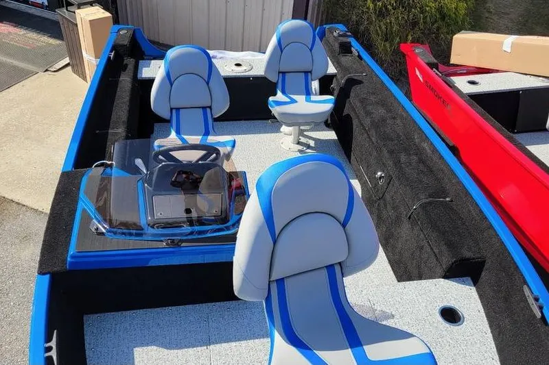 Slide: The Image of 2026 Smoker Craft Lazer 161 boat interior with blue and gray seating. - 14