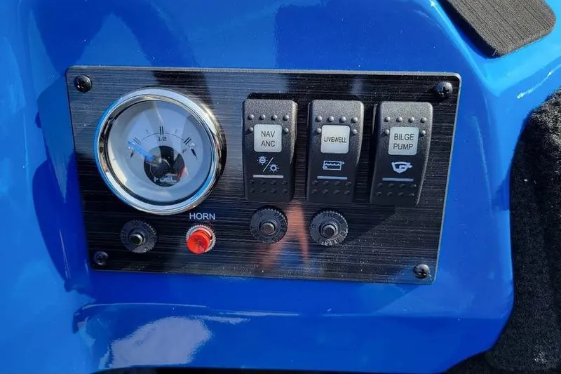 Slide: The Image of Control panel of 2026 Smoker Craft Lazer 161 boat with switches and gauge. - 16