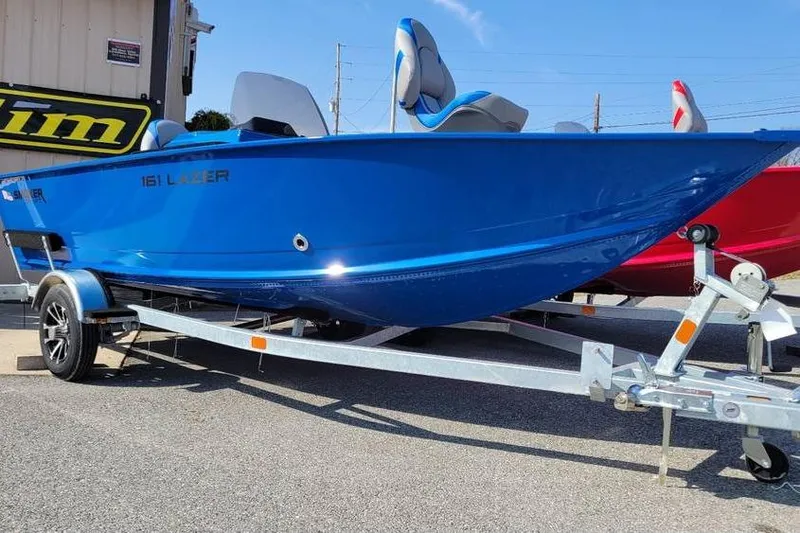 Slide: The Image of 2026 Smoker Craft Lazer 161 boat in vibrant blue on a trailer. - 9