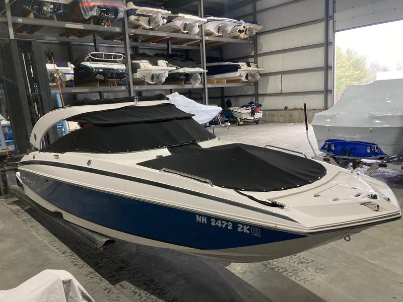 Slide: The Image of 2014 Regal 27 FasDeck boat in storage facility. - 1