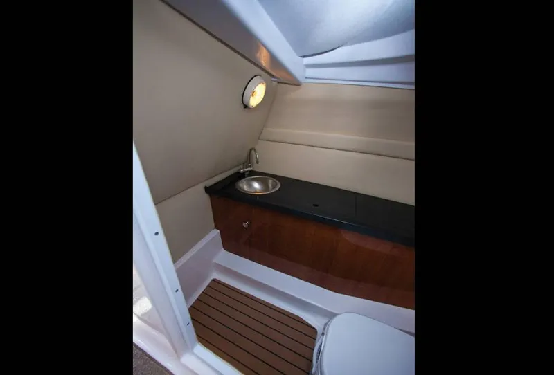 Slide: The Image of Interior of 2014 Regal 27 FasDeck with sink and toilet. - 2
