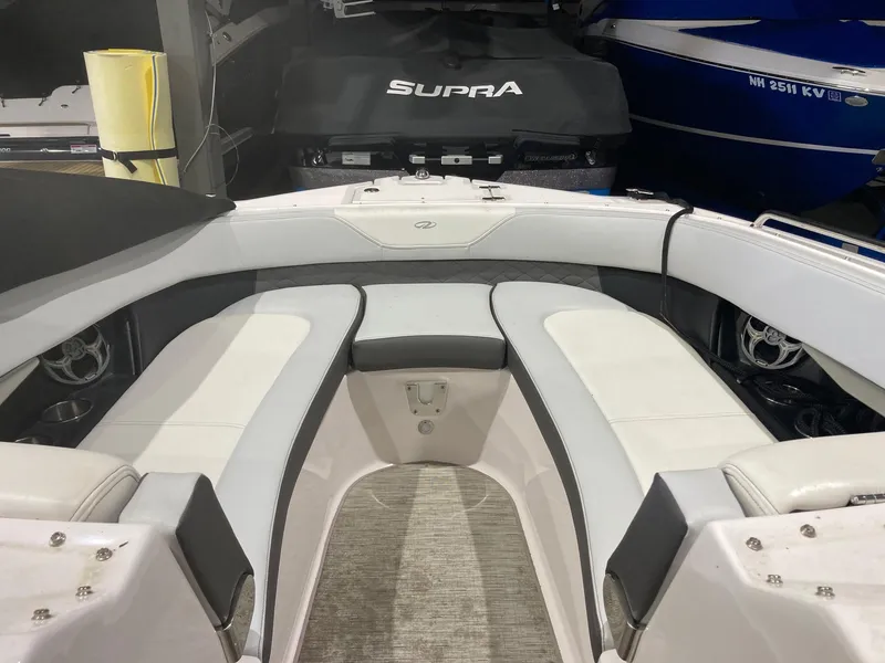 Slide: The Image of Interior of a 2014 Regal 27 FasDeck boat with white seating. - 4