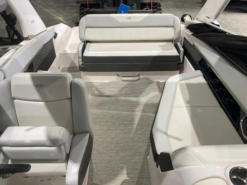 Slide: The Image of Interior of a 2014 Regal 27 FasDeck boat with white seating. - 5