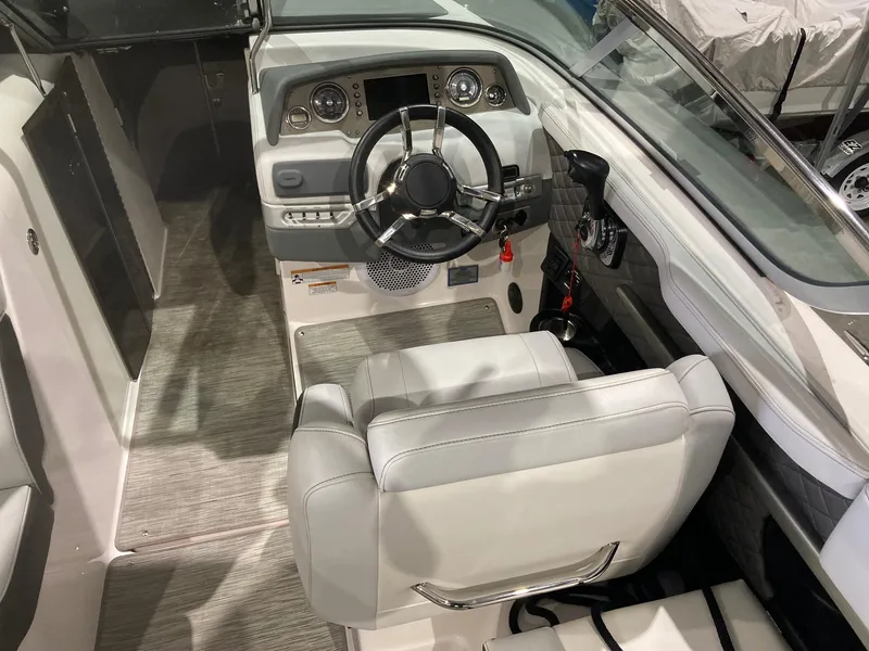 Slide: The Image of Interior of a 2014 Regal 27 FasDeck boat with steering console. - 8