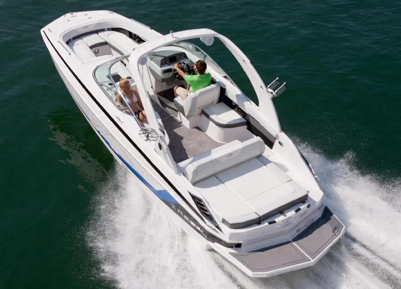Slide: The Image of 2014 Regal 27 FasDeck boat cruising on water. - 9