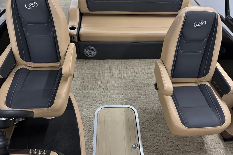 Slide: The Image of 2026 Barletta Cabrio 24UC boat interior with tan and black seating, carpeted floor. - 11