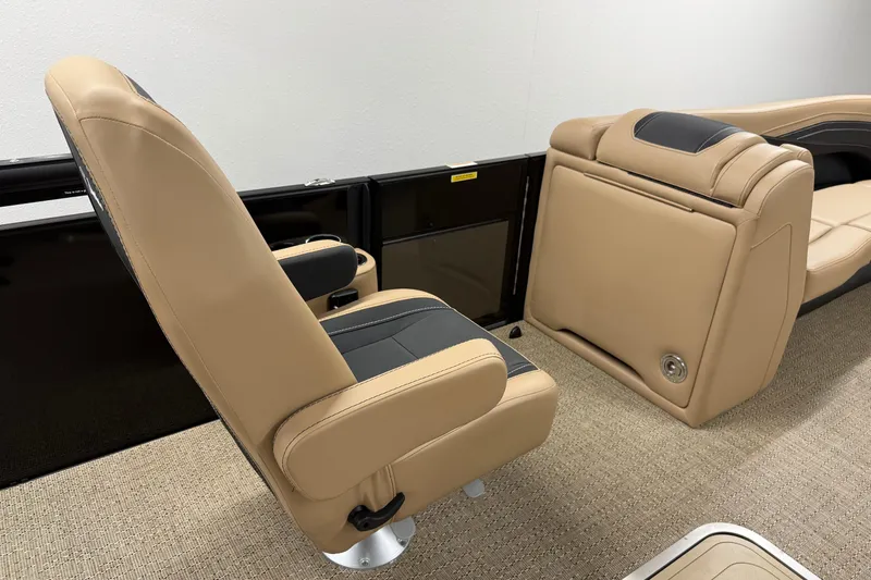 Slide: The Image of 2026 Barletta Cabrio 24UC boat interior with tan and black seating. - 16