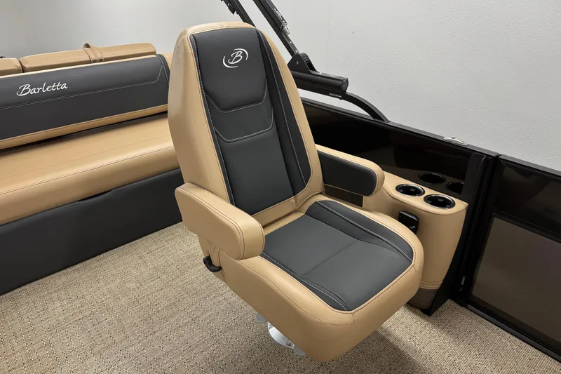 Slide: The Image of Luxurious seating in 2026 Barletta Cabrio 24UC boat, featuring tan and black upholstery. - 17