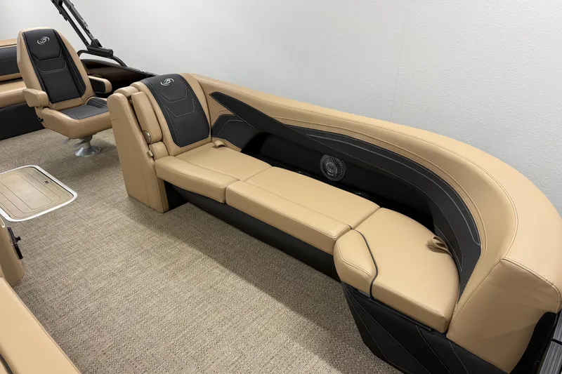 Slide: The Image of 2026 Barletta Cabrio 24UC boat interior with tan and black seating, showcasing luxury design. - 20