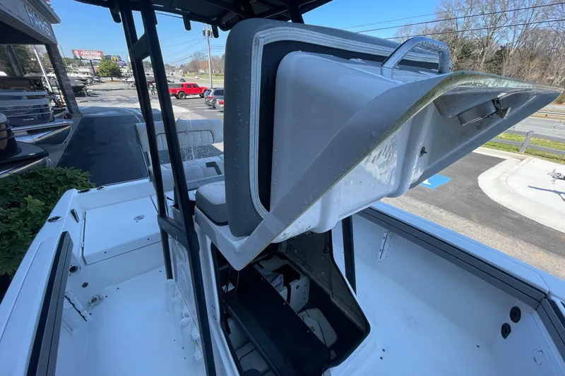 Slide: The Image of 2021 Yamaha Boats 195 FSH Sport interior with open storage compartment. - 19