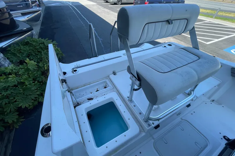 Slide: The Image of 2021 Yamaha Boats 195 FSH Sport interior with seating and storage compartments. - 20