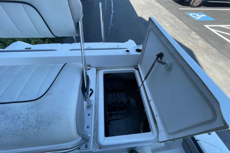 Slide: The Image of Open storage compartment on 2021 Yamaha Boats 195 FSH Sport, showcasing interior details. - 24