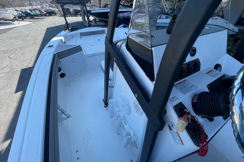 Slide: The Image of 2021 Yamaha Boats 195 FSH Sport interior, showcasing helm and seating area. - 25