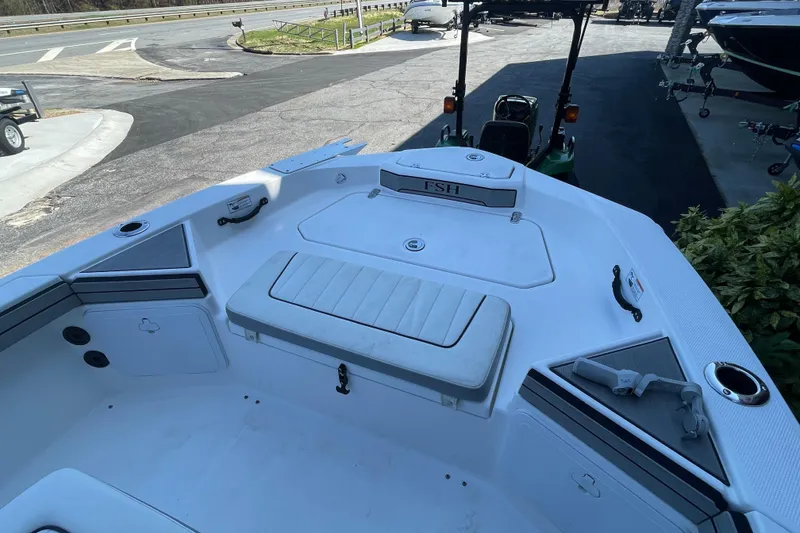 Slide: The Image of 2021 Yamaha Boats 195 FSH Sport interior, featuring seating and storage compartments. - 28