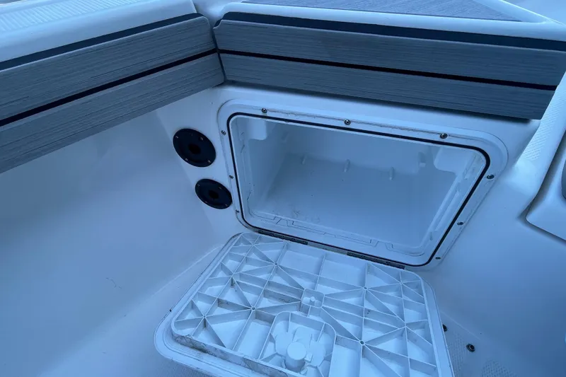 Slide: The Image of Open storage compartment on 2021 Yamaha Boats 195 FSH Sport. - 30