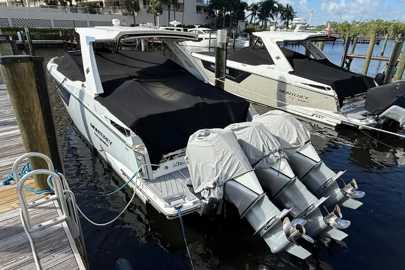 Slide: The Image of 2022 Monterey 385 Super Express yacht docked with covered engines. - 3