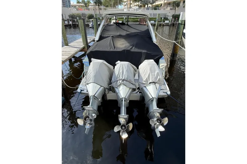 Slide: The Image of 2022 Monterey 385 Super Express boat docked with covered engines. - 4