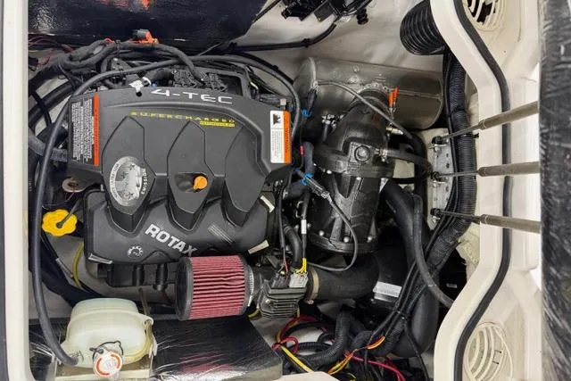 Slide: The Image of Engine compartment of a 2019 Scarab 195 G boat featuring a Rotax 4-TEC engine. - 18
