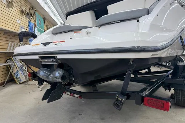 Slide: The Image of 2019 Scarab 195 G boat on trailer in indoor storage facility. - 23