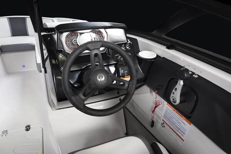 Slide: The Image of Interior seating of 2019 Scarab 195 G boat, featuring white and gray upholstery. - 7