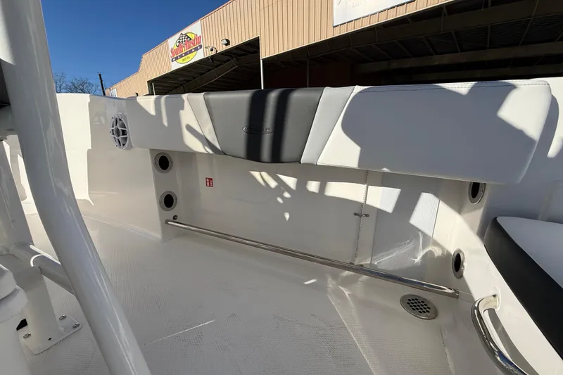 Slide: The Image of 2026 Robalo R200 Center Console boat interior with seating and storage features. - 12