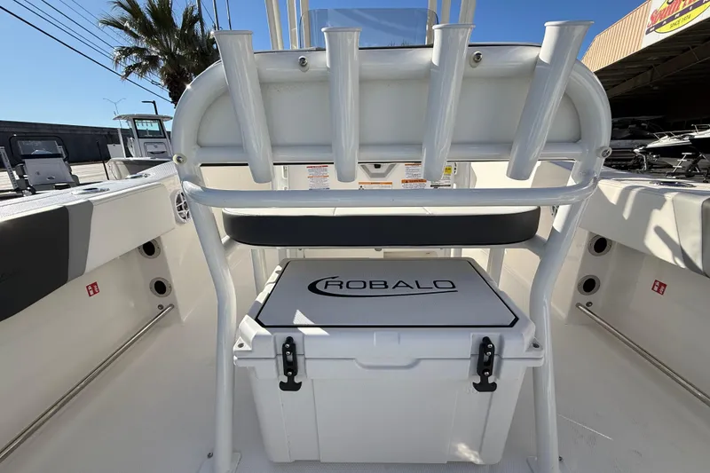Slide: The Image of 2026 Robalo R200 Center Console boat interior with rod holders and storage. - 13