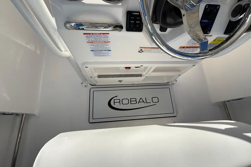 Slide: The Image of 2026 Robalo R200 Center Console interior with steering wheel and control panel. - 17