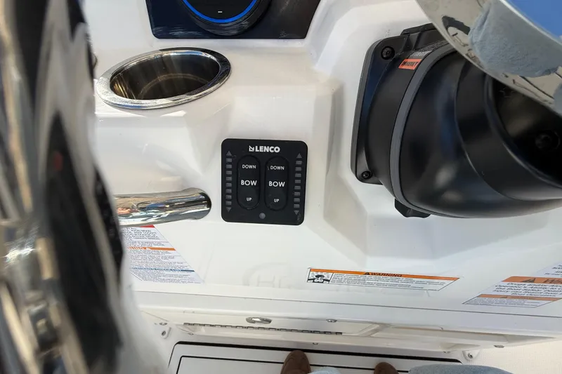 Slide: The Image of 2026 Robalo R200 Center Console boat controls with Lenco trim tab switches. - 24