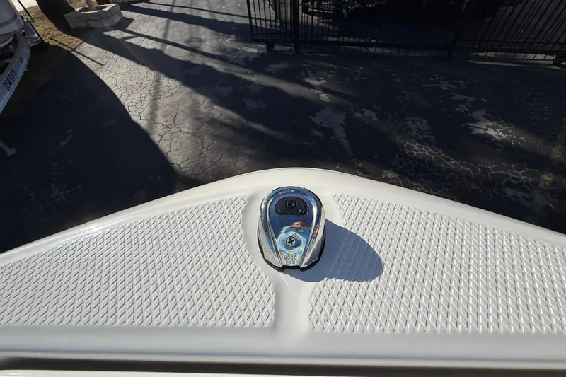 Slide: The Image of 2026 Robalo R200 Center Console boat bow with textured surface and cleat. - 36