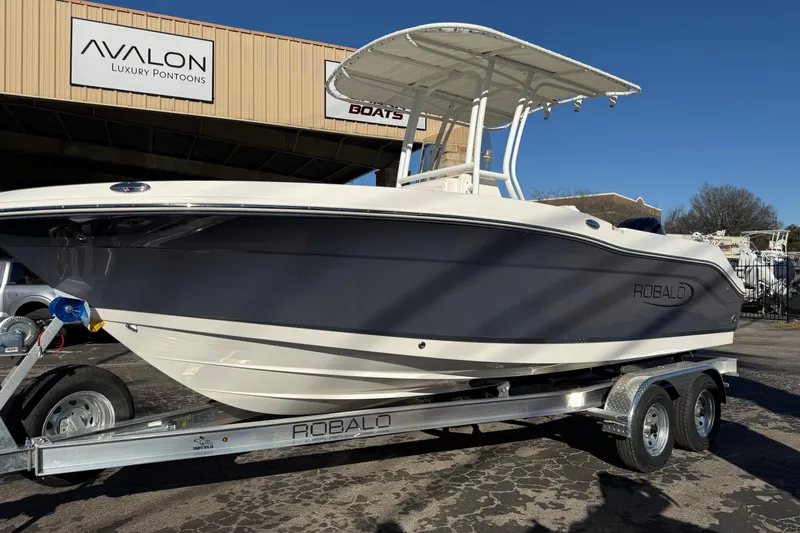 Slide: The Image of 2026 Robalo R200 Center Console boat on trailer at Avalon dealership. - 6