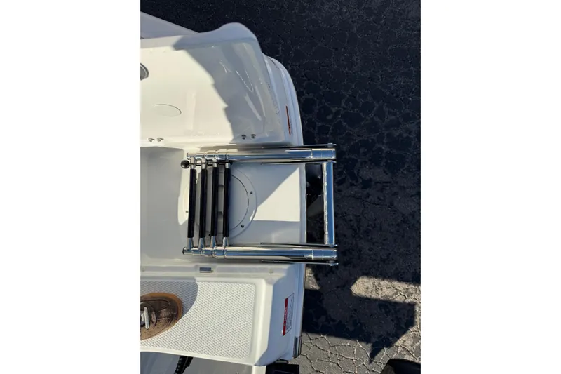 Slide: The Image of 2026 Robalo R200 Center Console boat with a stainless steel swim ladder. - 9