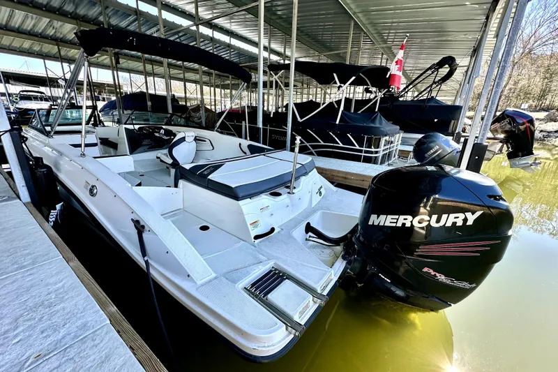 Slide: The Image of 2015 Sea Ray 21 SPX OB boat with Mercury outboard engine docked in marina. - 10