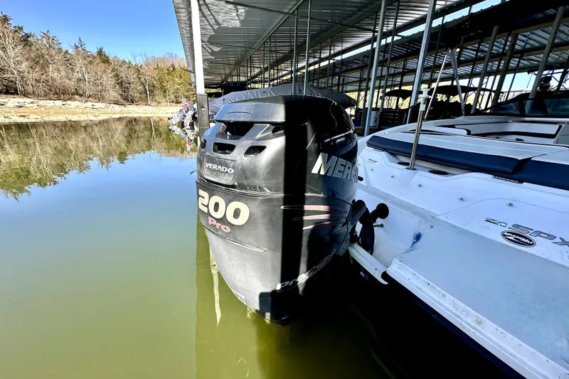 Slide: The Image of 2015 Sea Ray 21 SPX OB with Mercury 200 Pro outboard in marina. - 11