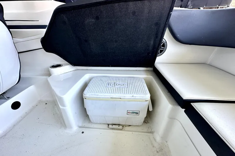 Slide: The Image of 2015 Sea Ray 21 SPX OB boat interior with Igloo cooler and seating area. - 7