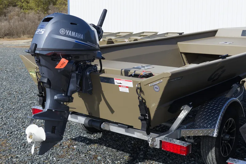 Slide: The Image of 2026 G3 Gator Tough 15 FL boat with Yamaha 25 outboard motor on trailer. - 2