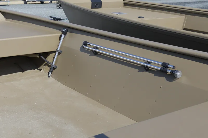 Slide: The Image of 2026 G3 Gator Tough 15 FL boat interior with rod holders and storage. - 7