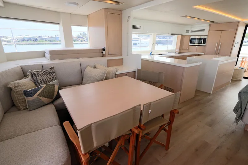 Slide: The Image of Luxurious interior of 2025 Two Oceans 55 yacht with modern kitchen and cozy seating area. - 13