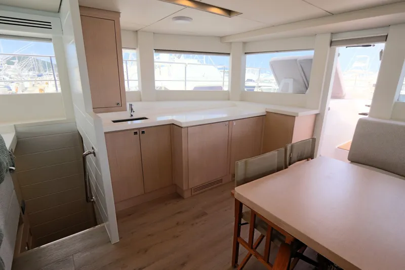 Slide: The Image of Modern interior of 2025 Two Oceans 55 yacht with spacious kitchen and dining area. - 14