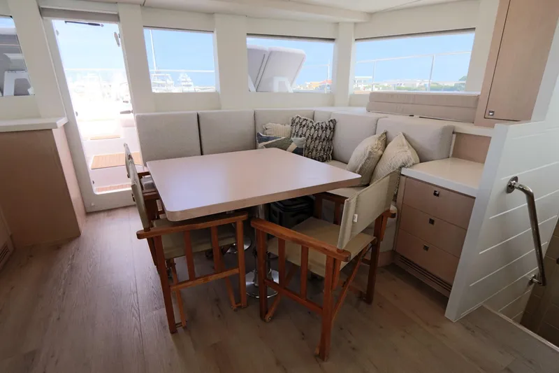 Slide: The Image of Modern interior of 2025 Two Oceans 55 yacht with dining area and plush seating. - 15