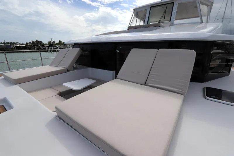 Slide: The Image of Luxurious 2025 Two Oceans 55 yacht with spacious sun loungers and sleek design. - 18