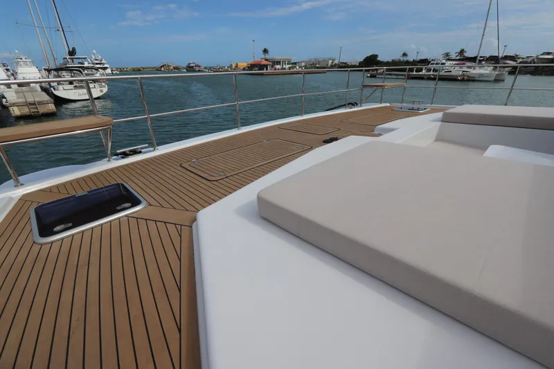 Slide: The Image of Luxurious deck of 2025 Two Oceans 55 yacht with elegant seating and scenic marina view. - 19
