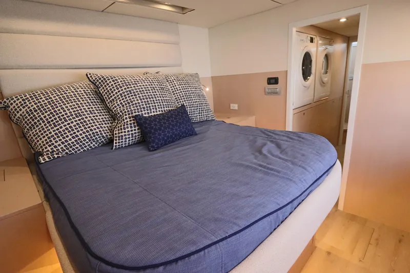 Slide: The Image of Luxurious bedroom in 2025 Two Oceans 55 yacht with modern amenities. - 22