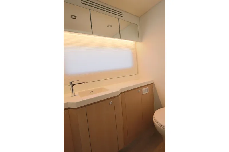Slide: The Image of Modern bathroom interior on 2025 Two Oceans 55 yacht, featuring sleek sink and cabinetry. - 24