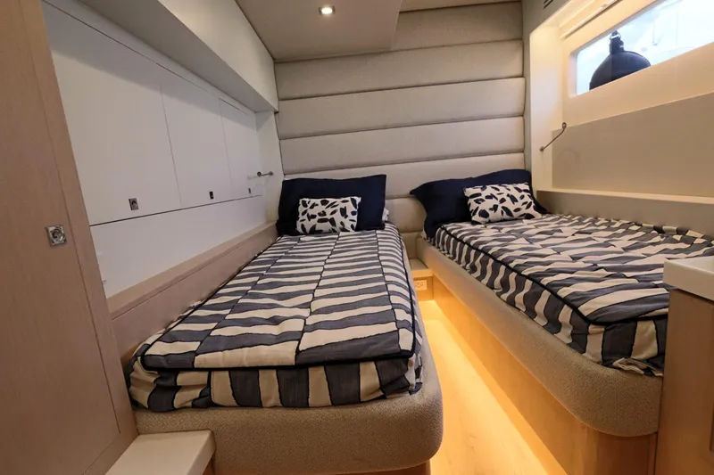 Slide: The Image of Luxurious cabin interior of 2025 Two Oceans 55 yacht with twin beds and modern decor. - 26