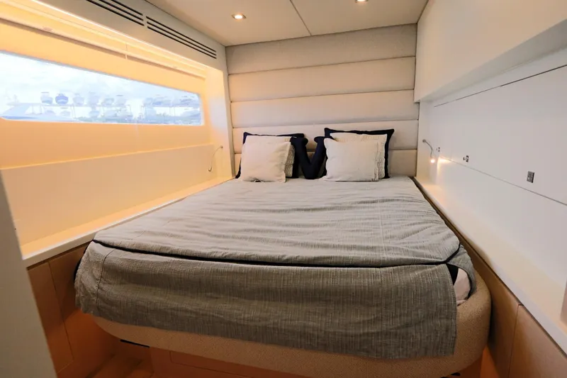 Slide: The Image of Luxurious bedroom interior of 2025 Two Oceans 55 yacht with modern design and cozy bedding. - 28